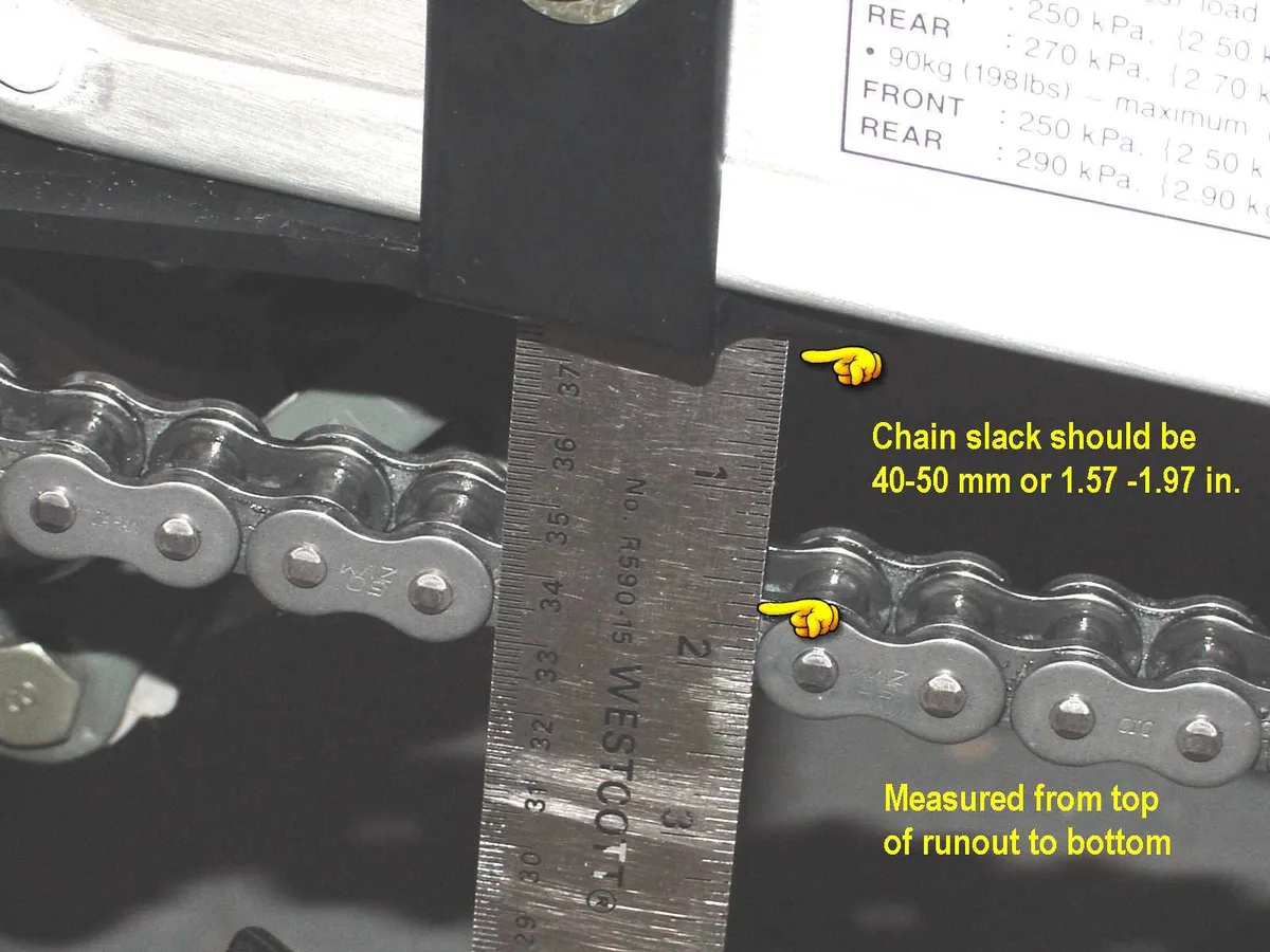 chain tension adjustment slots