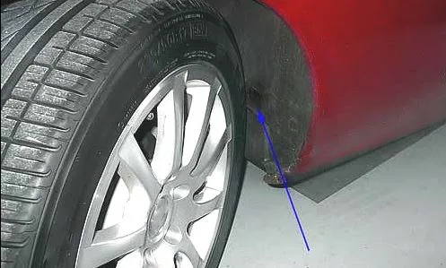 Misaligned fender rubbing tire